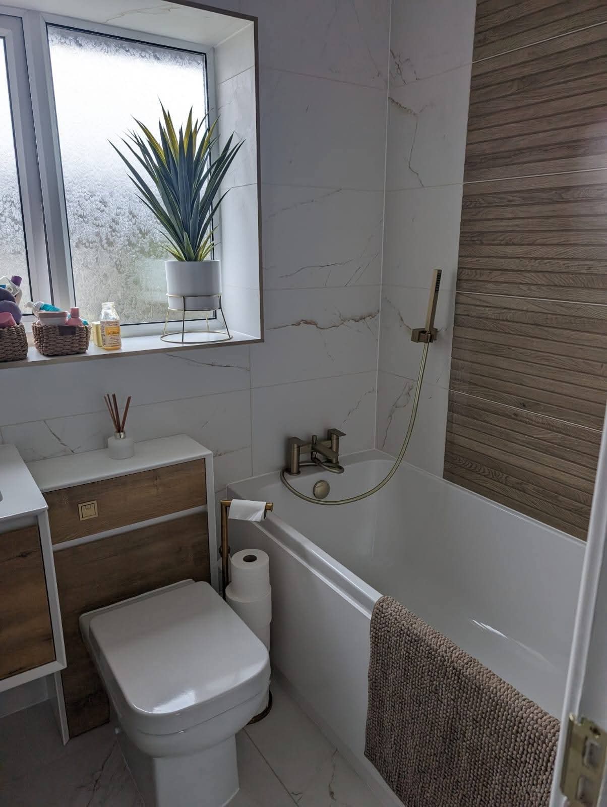 Freshly cleaned modern bathroom with marble tiling